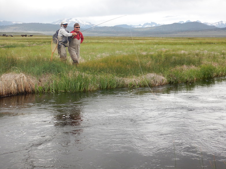 Trout guide Scott Flint coaches a fisherman on the upper Owens River. (Photo: Tom Adkinson)